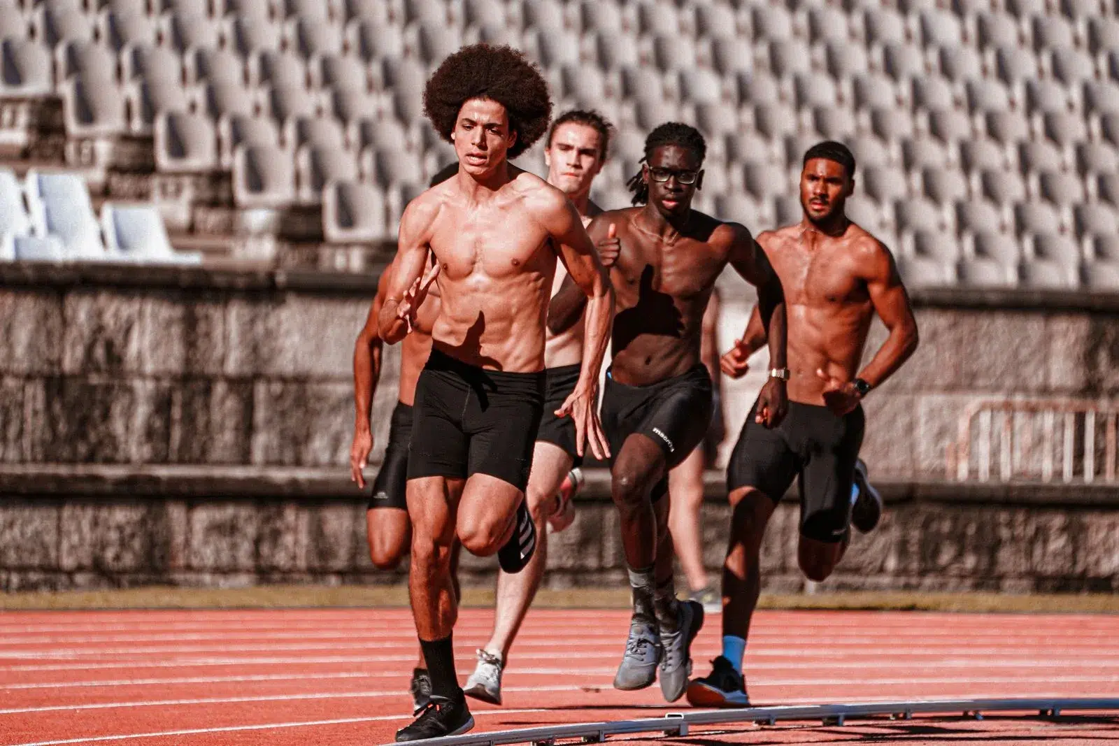 Sprinters racing on a track — a strong backlink profile is a competitive moat competitors can't easily copy
