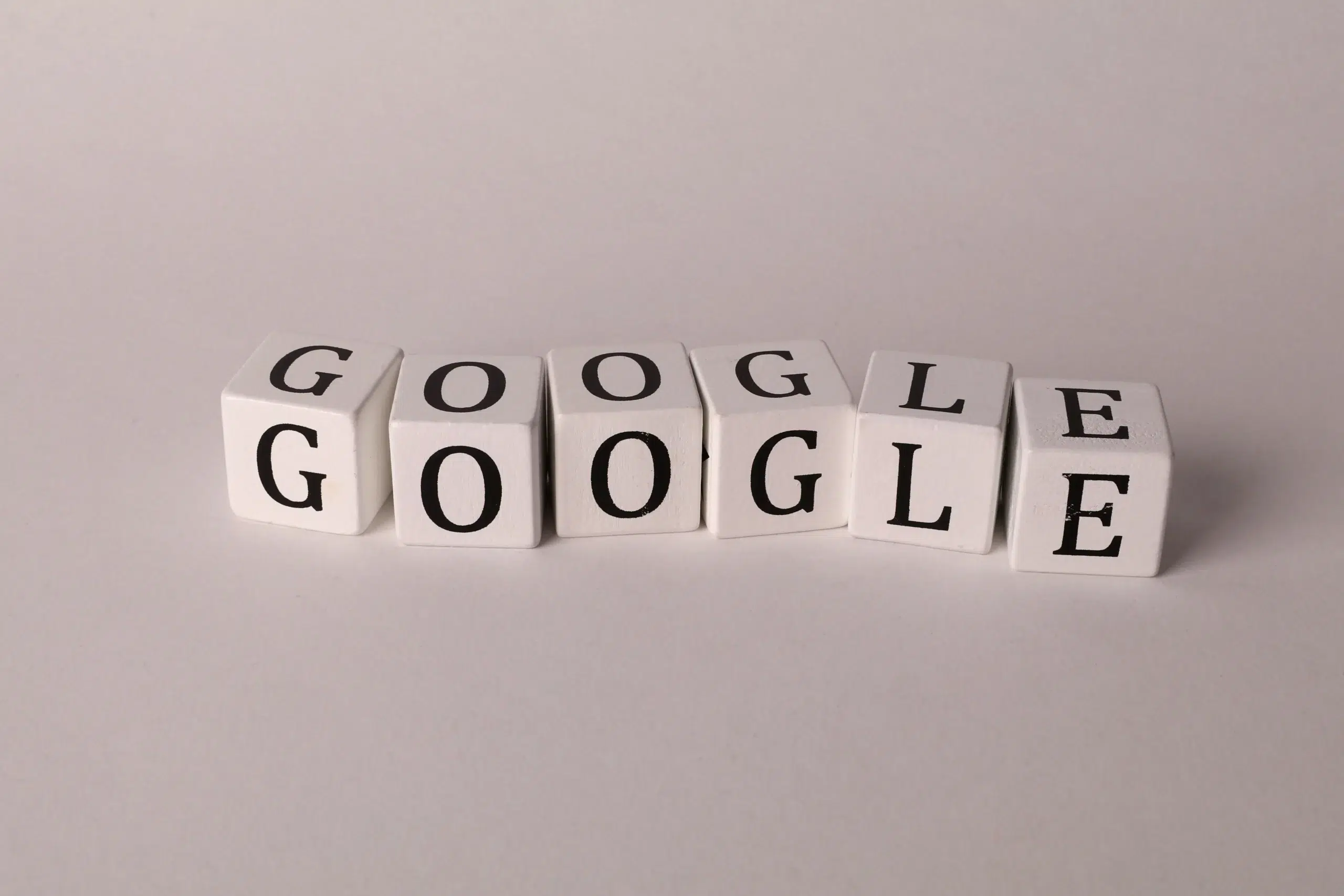 Letter cubes spelling GOOGLE — the search engine at the center of backlink benefits