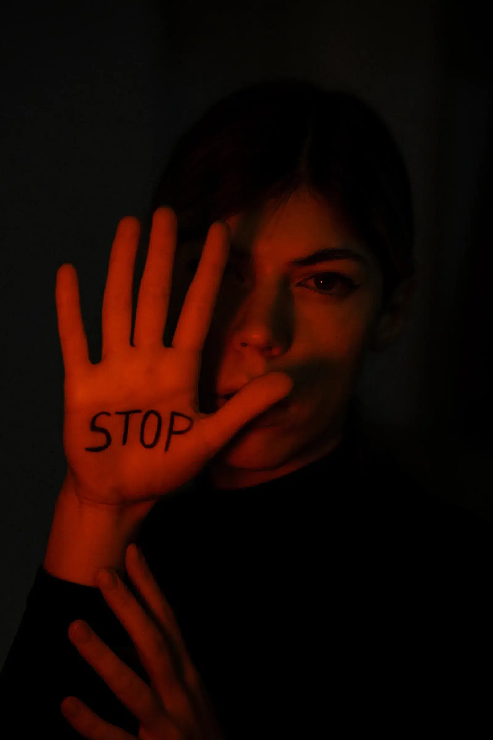 Hand raised with the word STOP written on the palm — stopping the biggest backlink myths