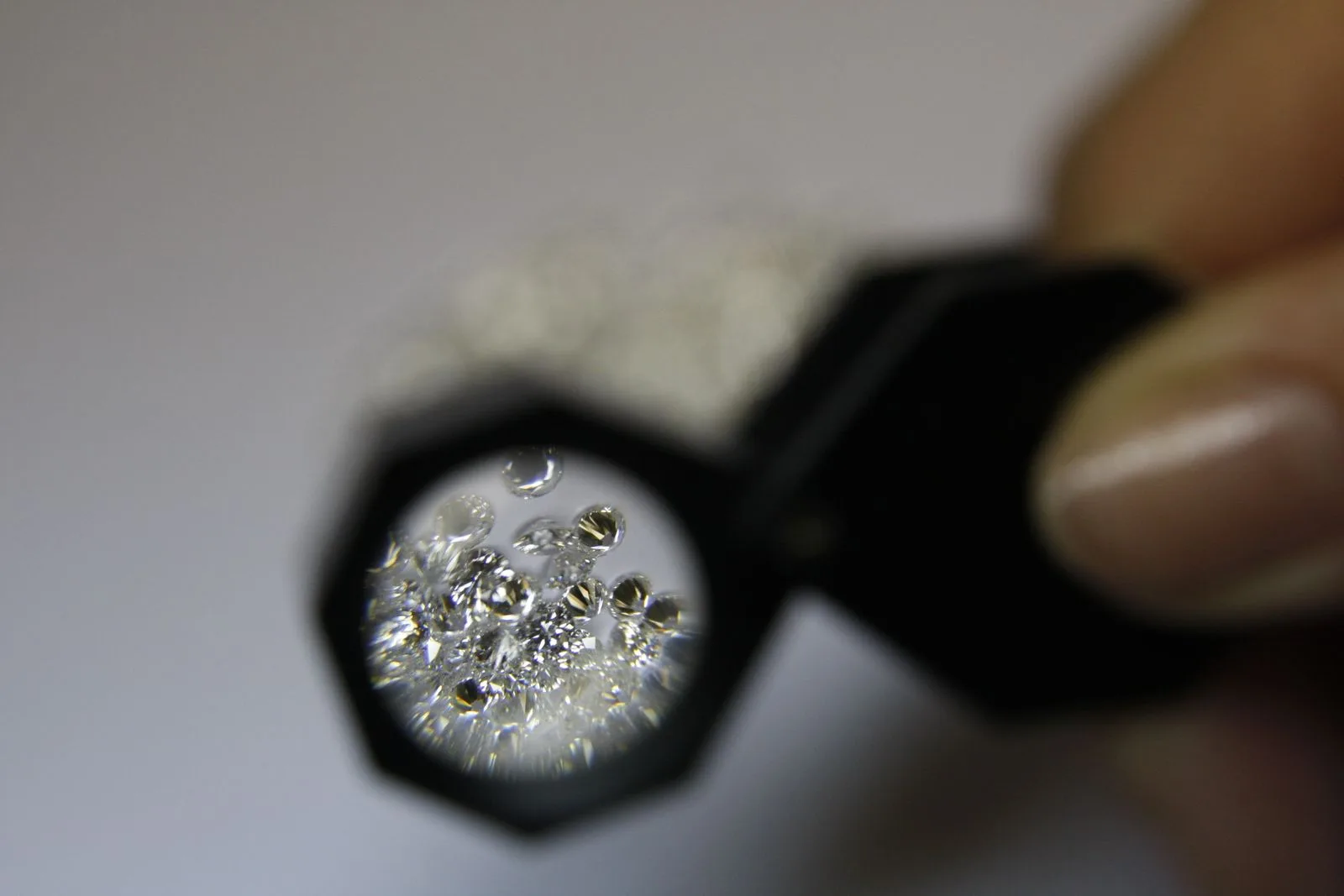 Magnifying glass examining a diamond — judging link quality requires inspecting what metrics hide